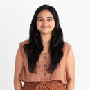 Woman wearing a brown outfit on a white background