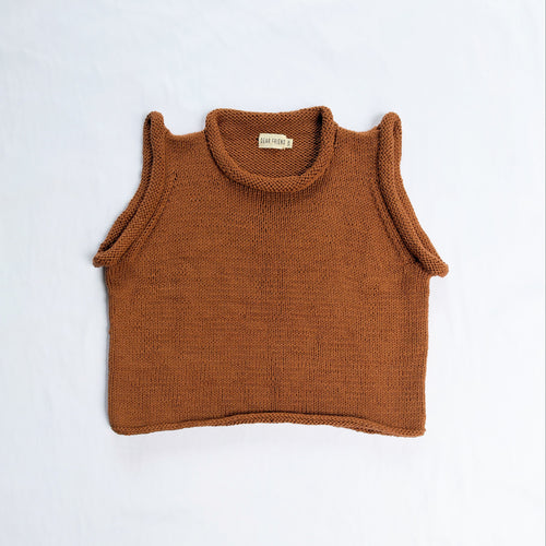 A brown knit sleeveless crop top with a roll neck, laid flat on a white background.