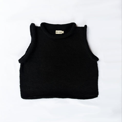 A black ribbed knit sleeveless crop top with a mock neck, laid flat on a white background. A small beige brand label is visible inside the collar.