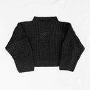 A black textured knit mock neck sweater with long sleeves