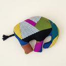 A colorful patchwork elephant toy with a black tassel